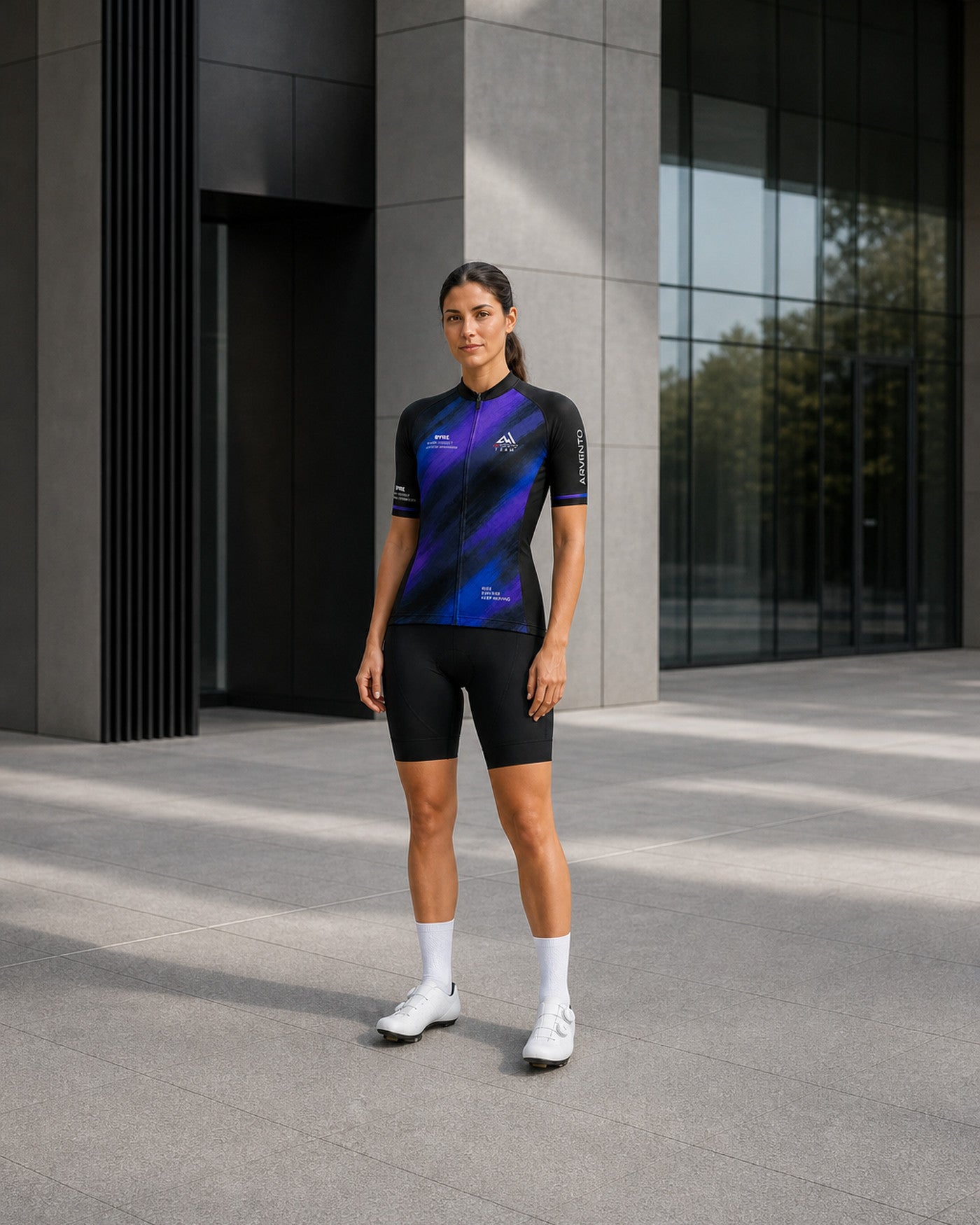 Female cyclist wearing the ARVENTO LB001 King of Mountain cycling jersey.