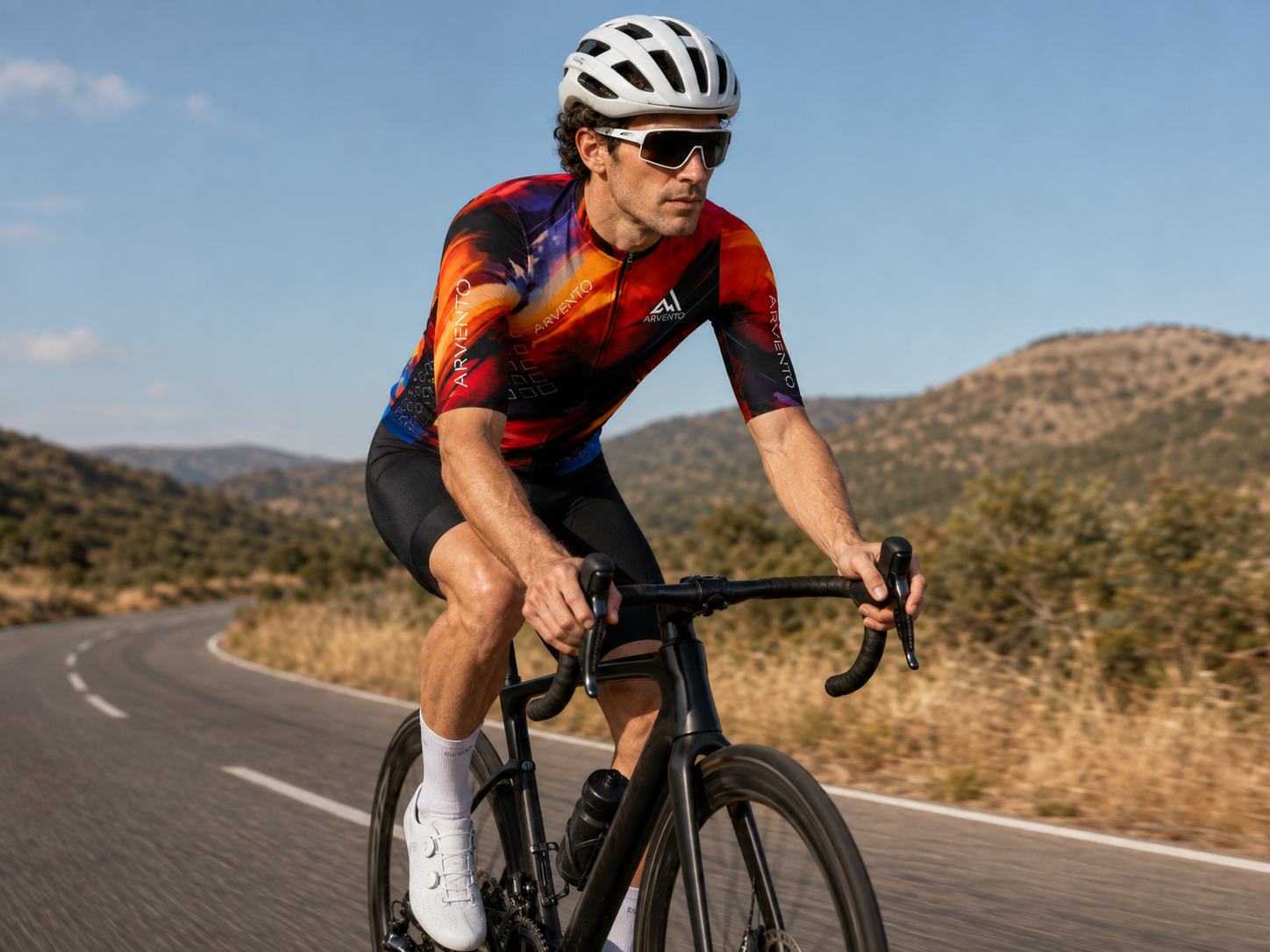 Cyclist wearing the ARVENTO CB001 Abstract Brush jersey during a performance-focused road ride.