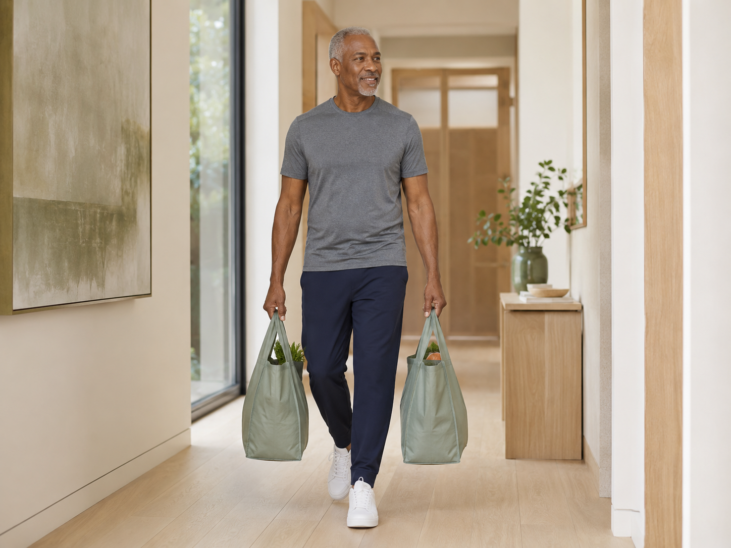 Walk a short, clear path while holding light, evenly balanced objects.